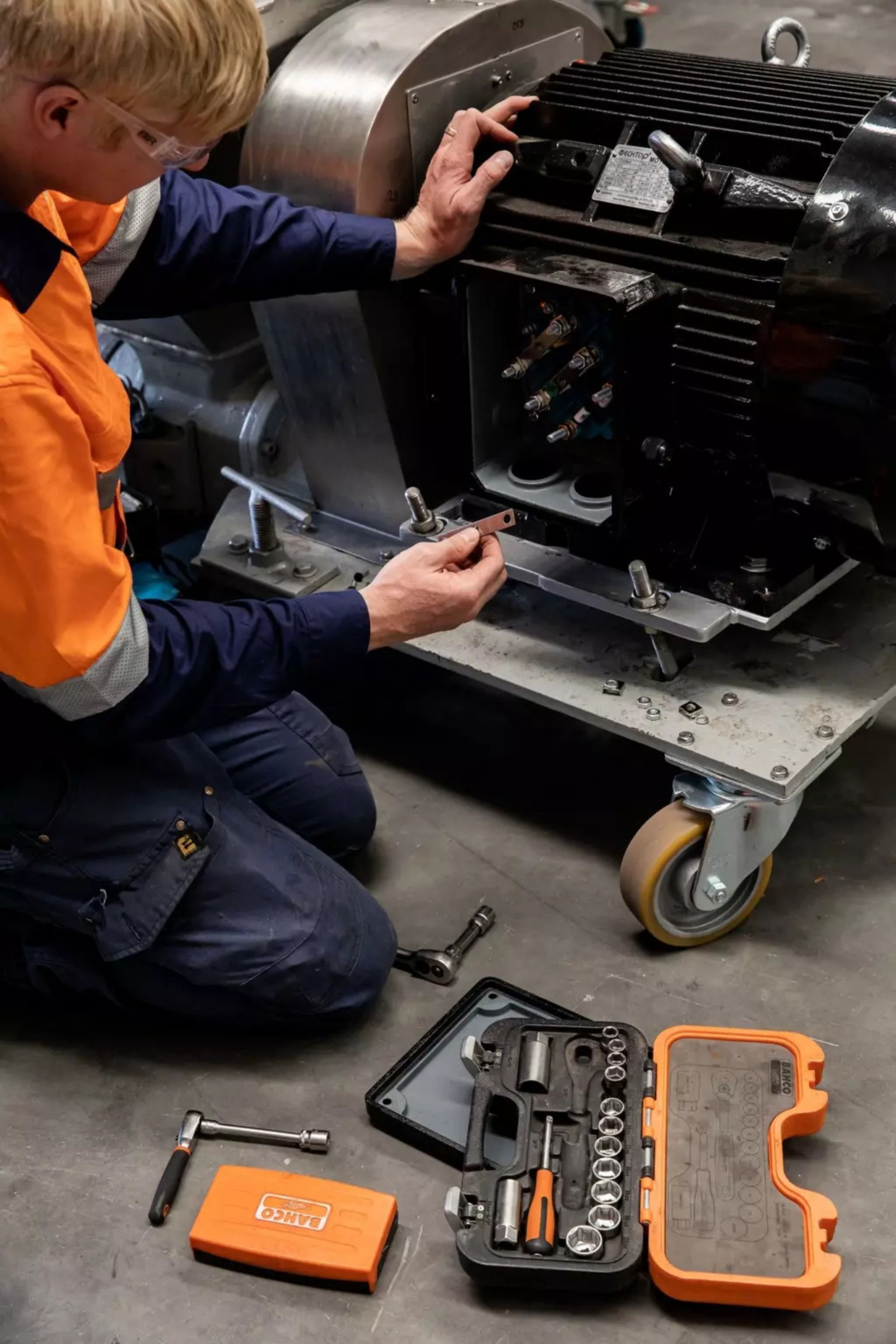 Engineer servicing an industrial motor