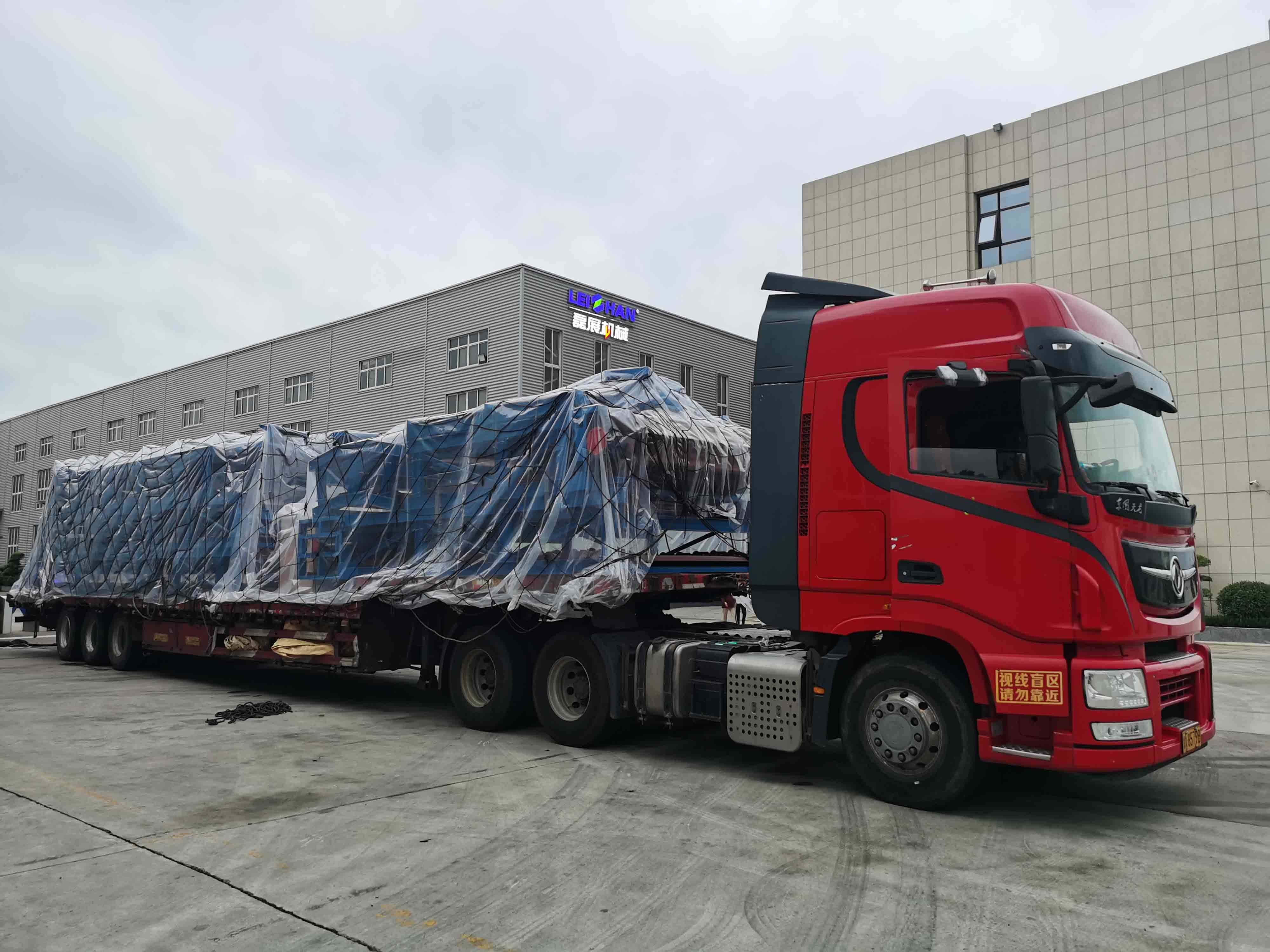 Heavy-duty truck hauling a covered load