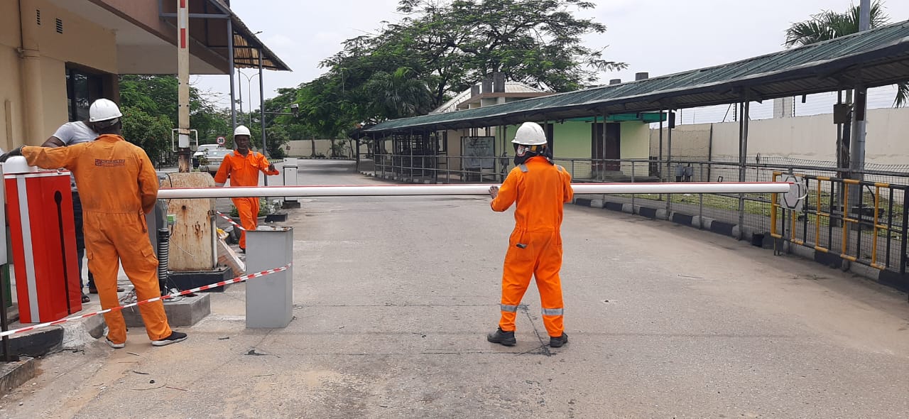 Crew installing a boom barrier