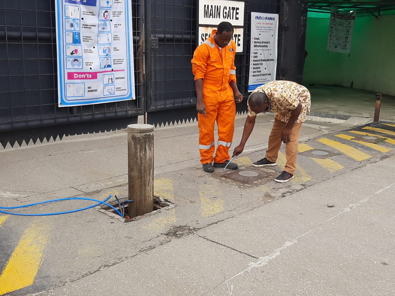 Technicians servicing a bollard